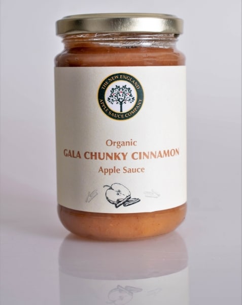 jar of gala chunky cinnamon apple sauce on a reflective background