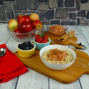 easy apple sauce porridge with selection of fruit in the picture