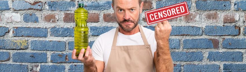 chef with an angry look on his face and his middle finger stuck up. A censored sign covering his finger